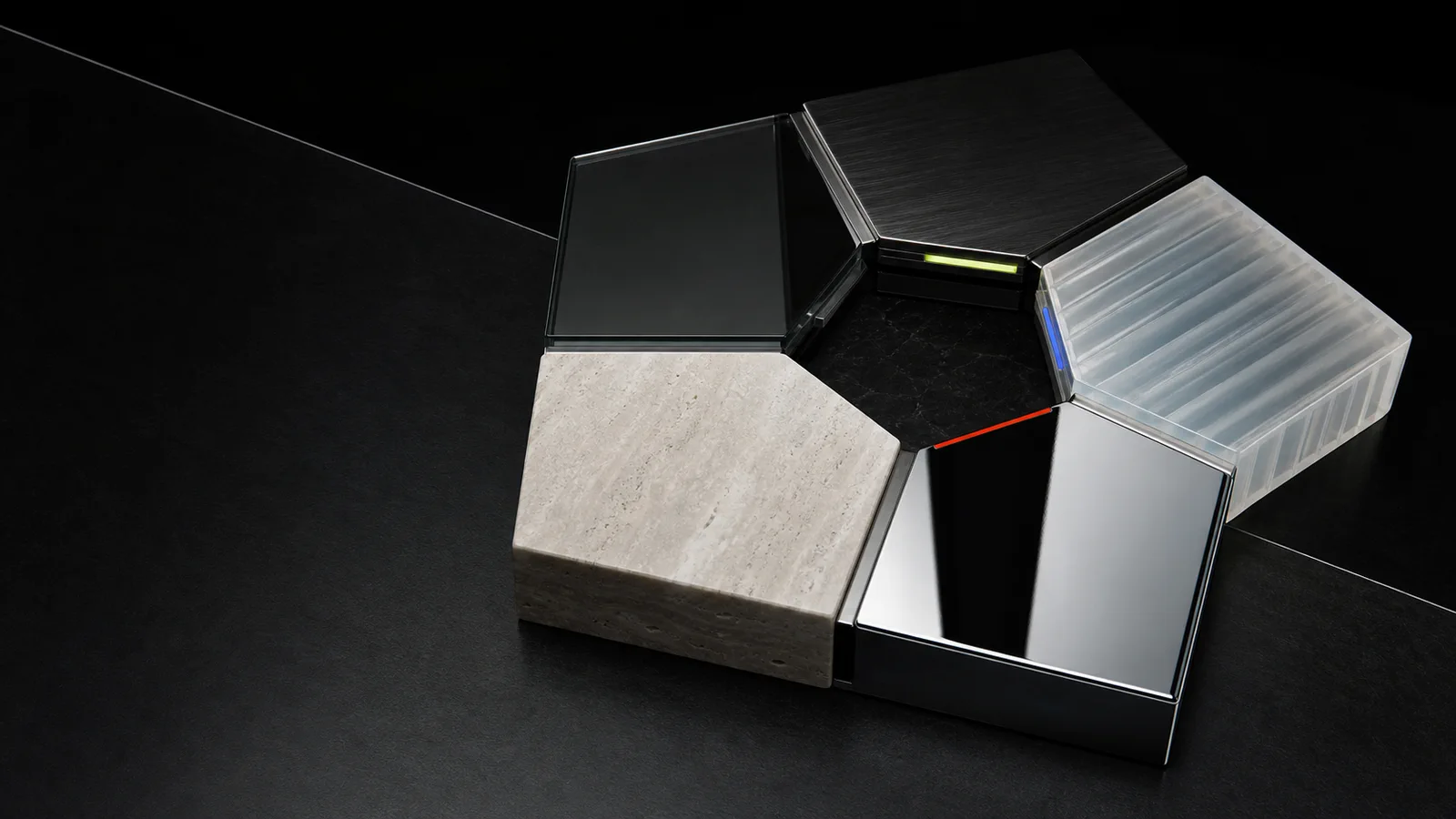 Five interlocking planes of glass, metal, stone, resin, and chrome surrounding a protected center